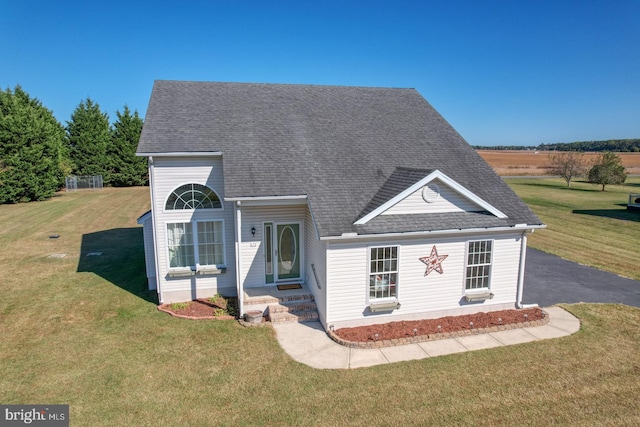 view of front facade with a front yard and a patio area