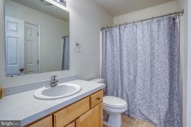 bathroom with vanity, curtained shower, toilet, and tile patterned flooring