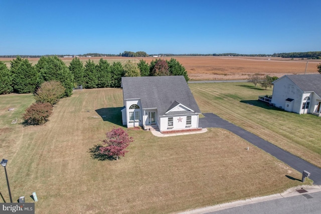 birds eye view of property with a rural view