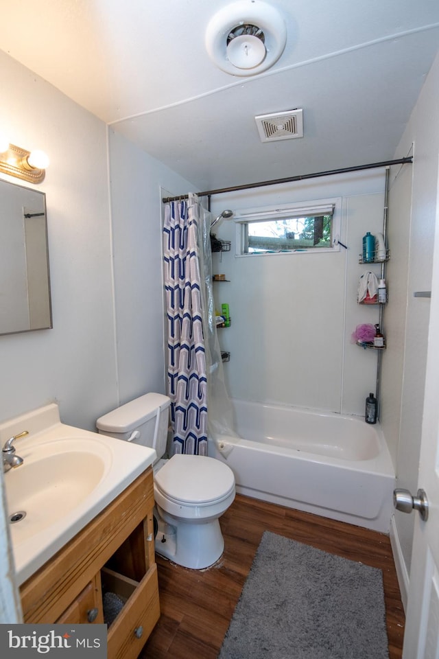 full bathroom with toilet, vanity, shower / bath combo with shower curtain, and wood-type flooring