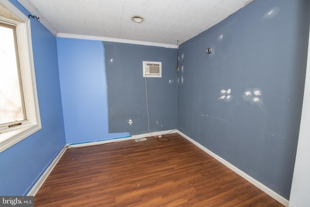 1019 Green Ln, Levittown, PA 19057 - unfurnished room with an ornate ceiling, a wall unit AC, baseboards, ornamental molding, and wood finished floors