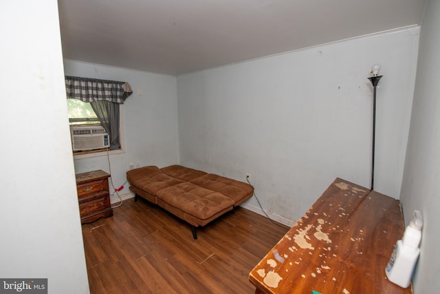 bedroom featuring dark wood-type flooring and cooling unit