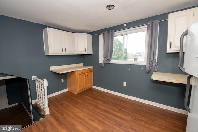 1019 Green Ln, Levittown, PA 19057 - kitchen featuring baseboards, light countertops, dark wood finished floors, and white cabinets