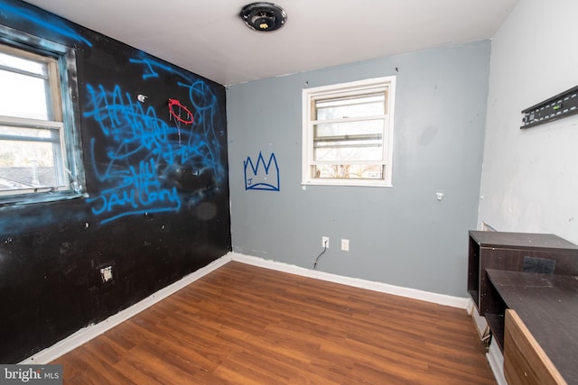 1019 Green Ln, Levittown, PA 19057 - spare room featuring baseboards, plenty of natural light, and wood finished floors