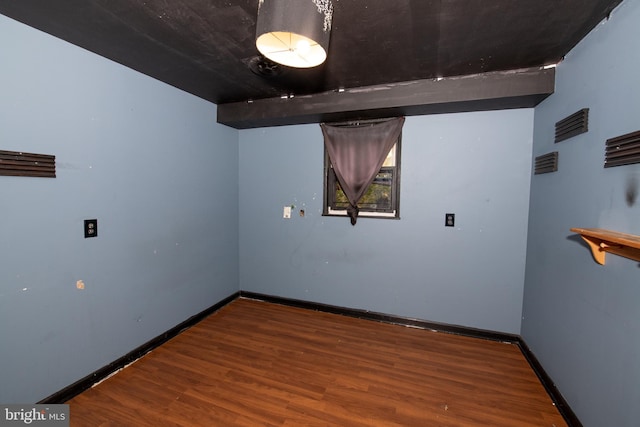 empty room featuring wood-type flooring