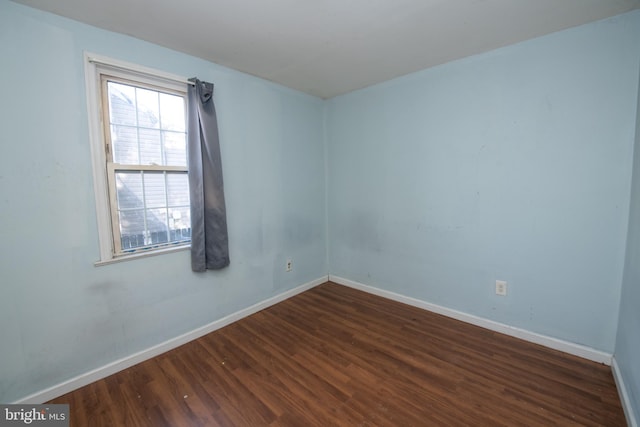 1019 Green Ln, Levittown, PA 19057 - empty room with baseboards and dark wood-style floors