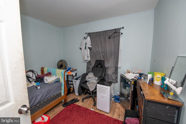 bedroom with wood-type flooring