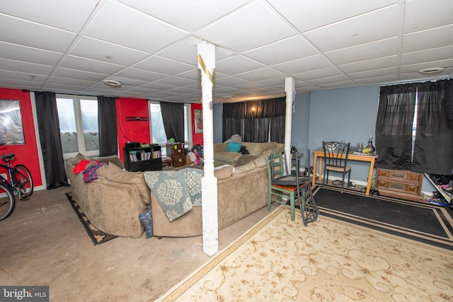 living room featuring a drop ceiling