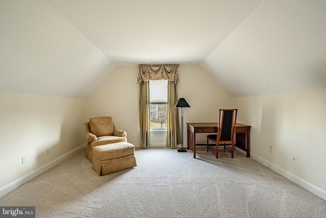 sitting room with carpet floors and lofted ceiling