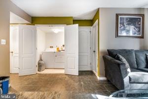 living room with washing machine and clothes dryer