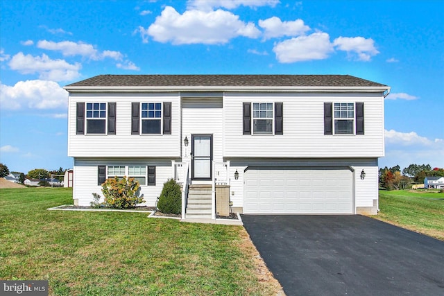 split foyer home with a garage and a front lawn