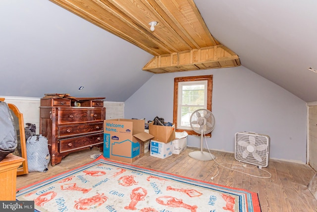 bonus room with wood-type flooring and lofted ceiling