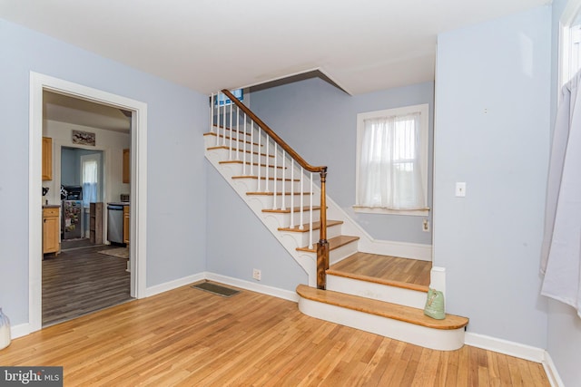 stairway featuring hardwood / wood-style flooring