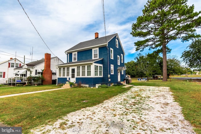 bungalow featuring a front yard