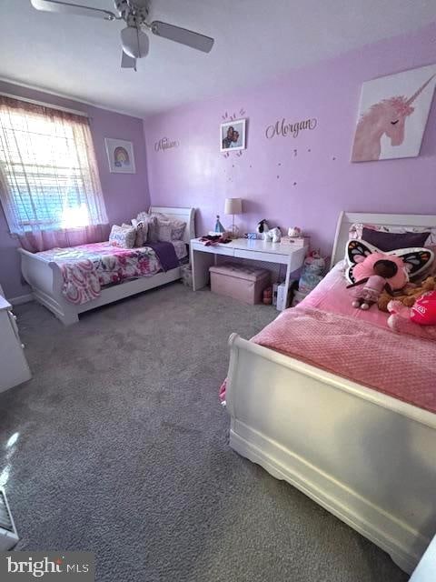 carpeted bedroom with ceiling fan