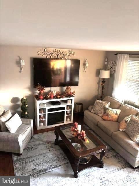 living room featuring a fireplace