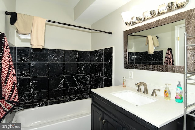 bathroom featuring vanity and tiled shower / bath combo