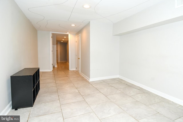 hallway featuring light tile patterned flooring