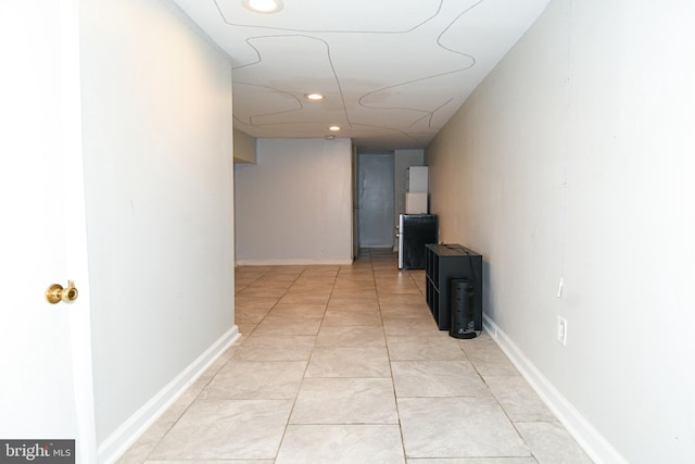 hallway featuring light tile patterned floors