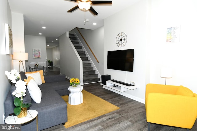 living room featuring dark hardwood / wood-style floors and ceiling fan