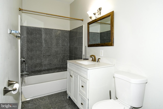 full bathroom featuring vanity, tiled shower / bath, and toilet