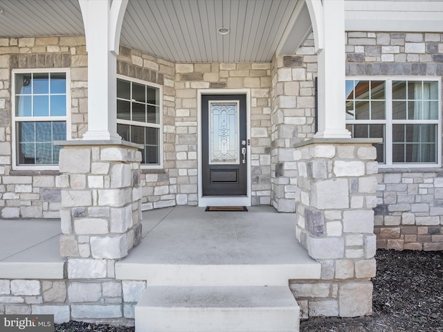 doorway to property featuring a porch