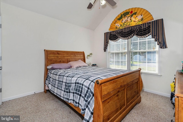 bedroom with vaulted ceiling, light colored carpet, and ceiling fan