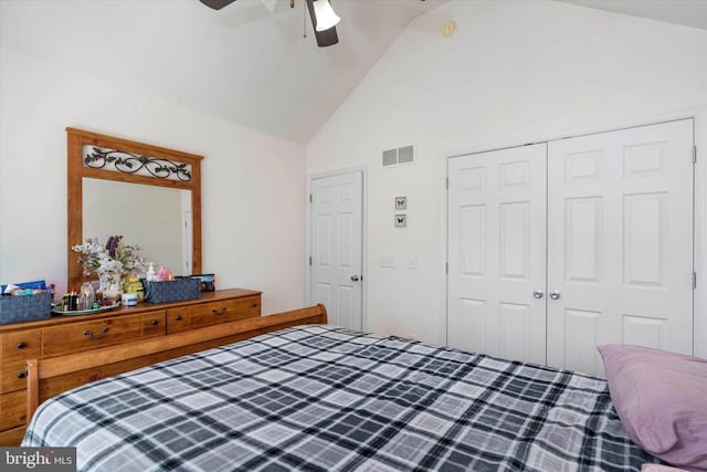 bedroom with high vaulted ceiling, a closet, and ceiling fan