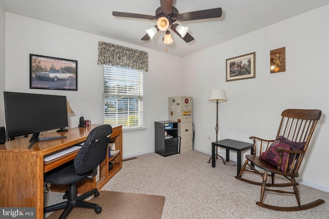 carpeted home office with ceiling fan