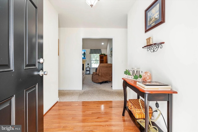 foyer entrance with light hardwood / wood-style floors