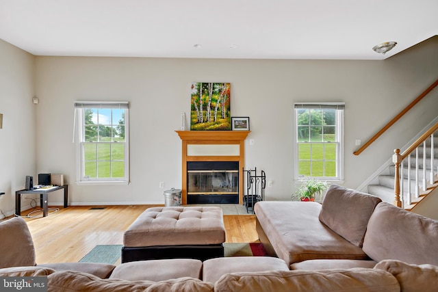 living room featuring a healthy amount of sunlight and light wood-type flooring