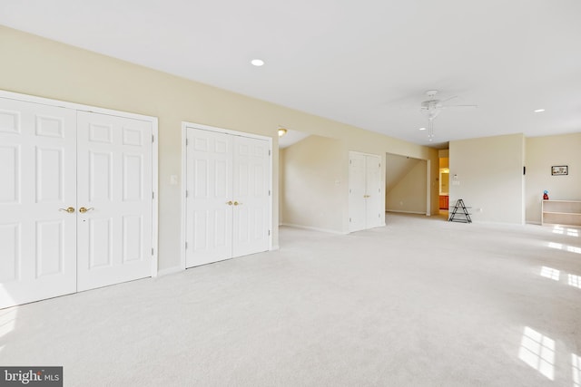 interior space with ceiling fan