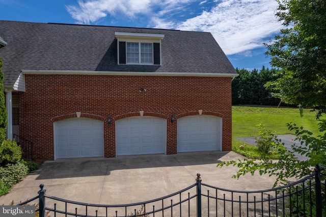 view of front facade with a front yard and a garage