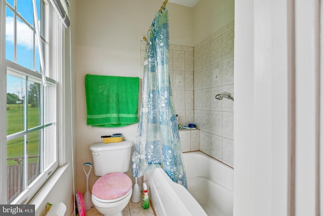 bathroom with shower / bath combination with curtain, toilet, and tile patterned floors