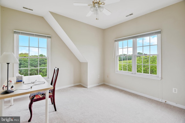 carpeted office featuring lofted ceiling and ceiling fan