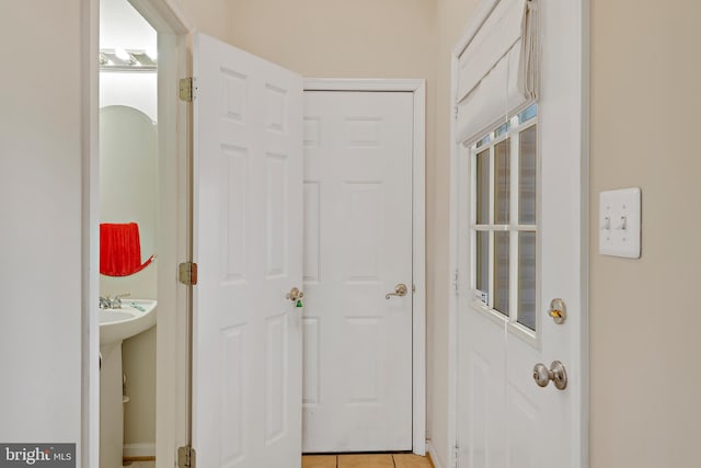 hallway with light tile patterned floors