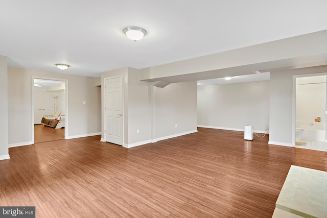 basement with wood-type flooring