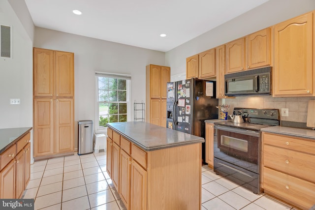 kitchen with light brown cabinets, backsplash, black appliances, a center island, and light tile patterned floors