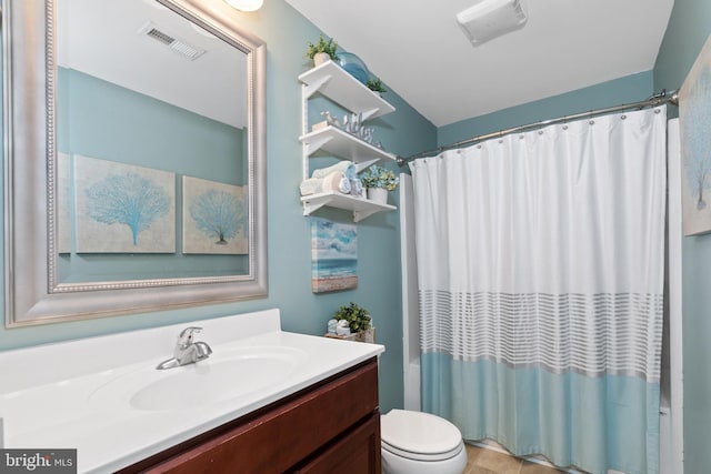 full bathroom with vanity, shower / tub combo, and toilet