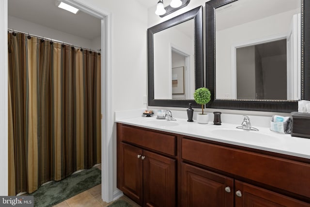 bathroom with tile patterned flooring and vanity