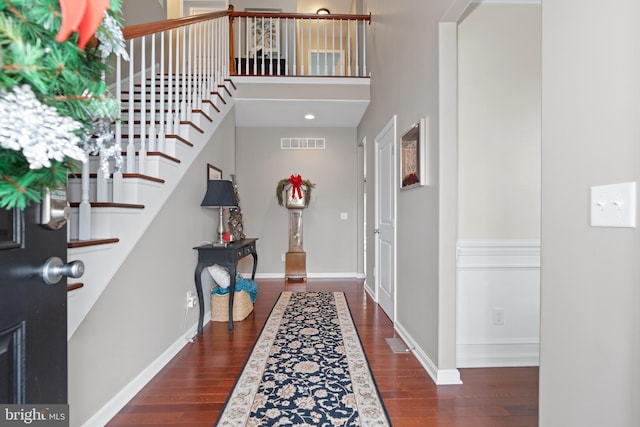 entrance foyer featuring dark hardwood / wood-style floors