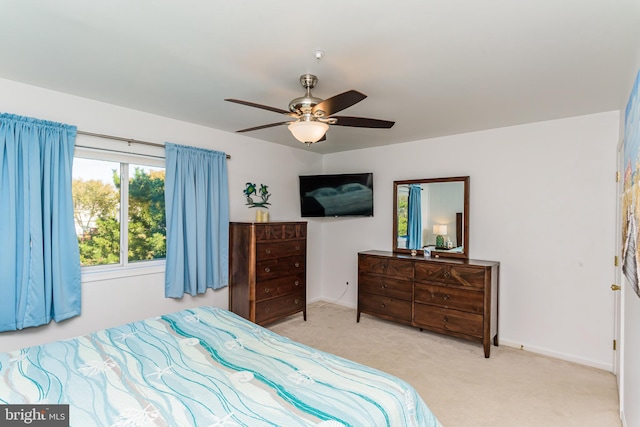 carpeted bedroom with ceiling fan