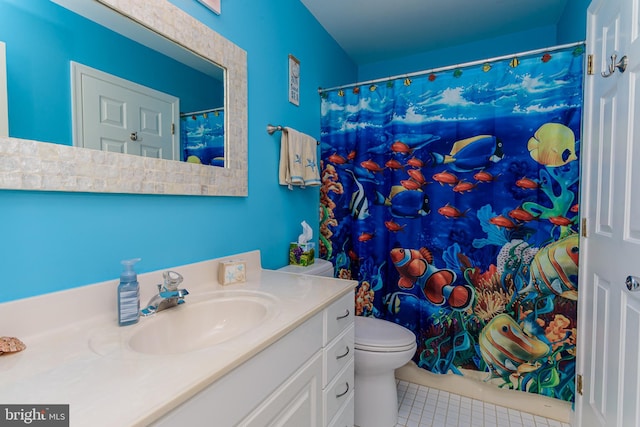 bathroom with vanity, toilet, a shower with shower curtain, and tile patterned flooring