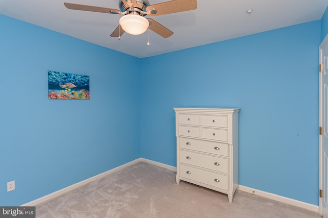 unfurnished bedroom featuring ceiling fan and light colored carpet