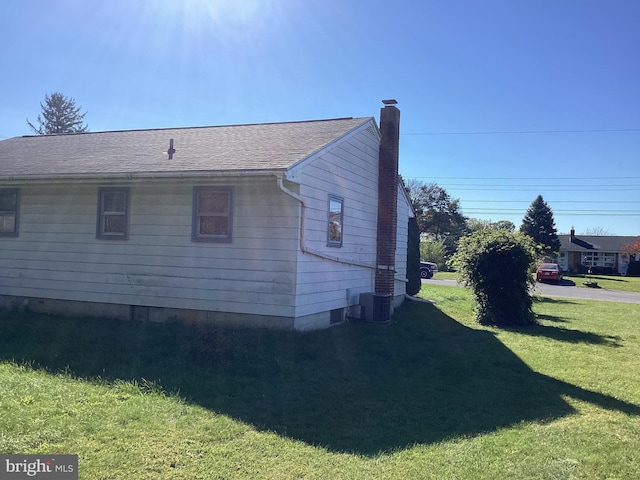 17604 Woodlawn Dr, Hagerstown, MD 21740 - view of home's exterior featuring a yard, a shingled roof, and a chimney