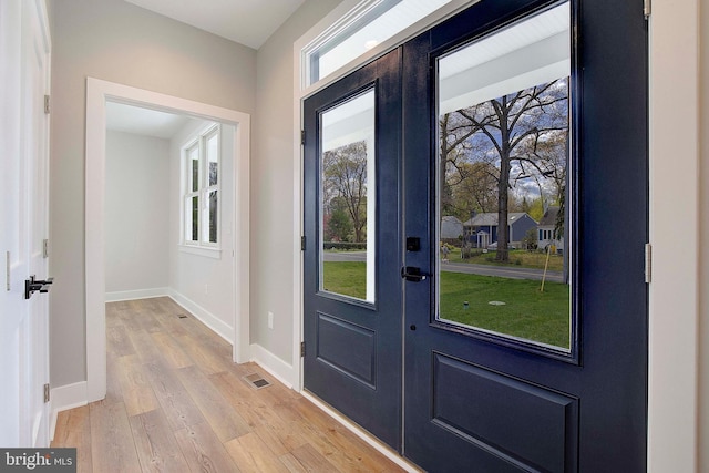 127 Shore Rd, Arnold, MD 21012 - doorway featuring baseboards, light wood finished floors, and french doors