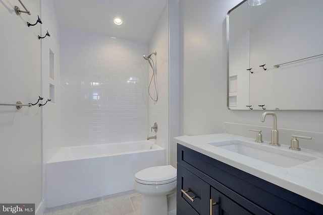 full bathroom with tile patterned flooring, vanity, toilet, and tiled shower / bath