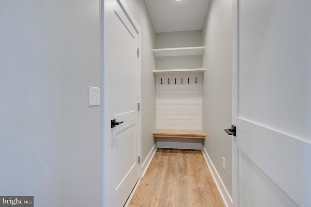 mudroom with light hardwood / wood-style flooring