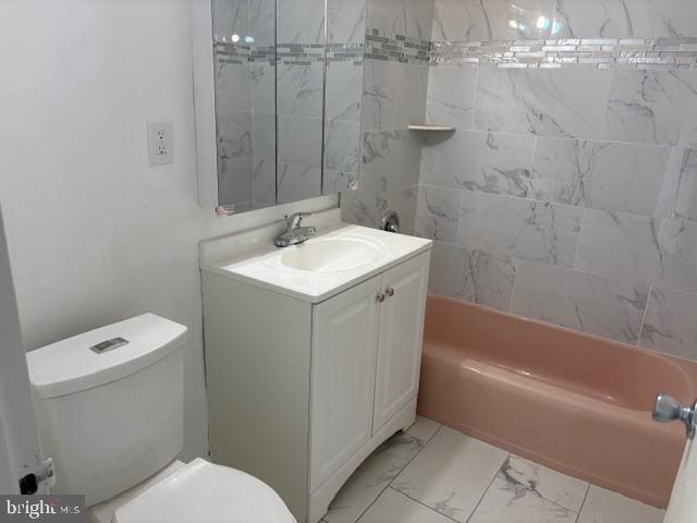 full bathroom with vanity, toilet, and tiled shower / bath