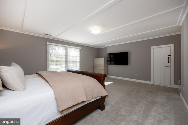 carpeted bedroom featuring ornamental molding